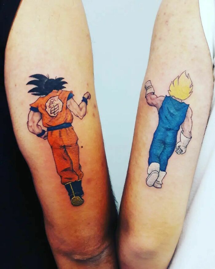 Anime character tattoos on arms, ideal for small, simple brother and sister tattoo ideas.