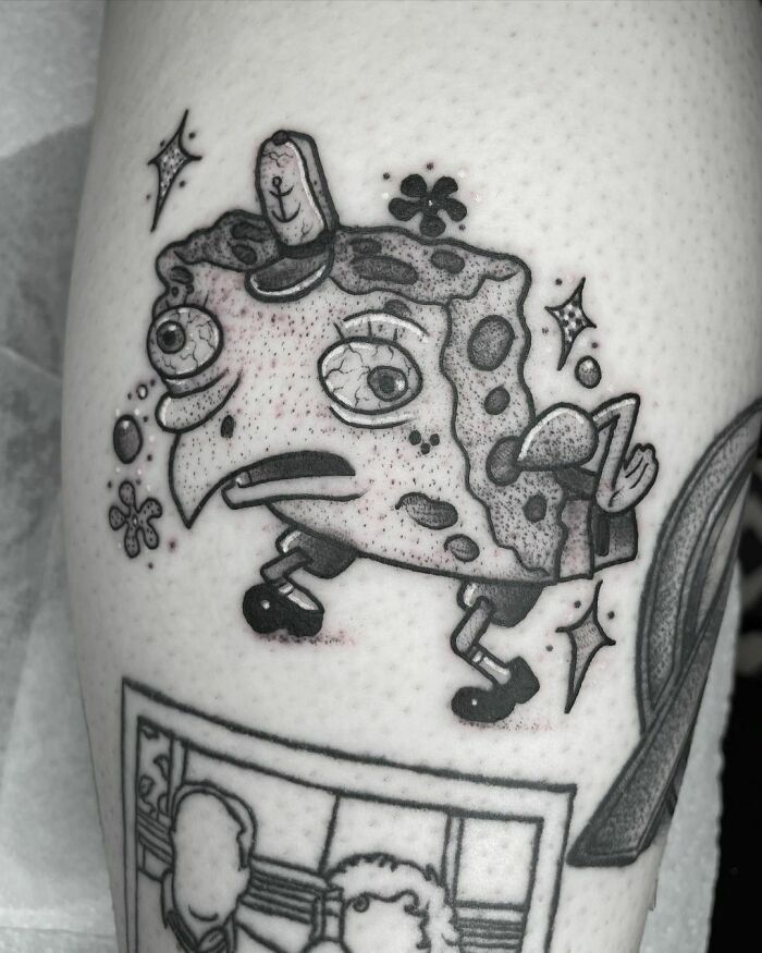 Cartoon tattoo featuring a character reminiscent of a well-known childhood favorite, illustrated in a unique black ink style.