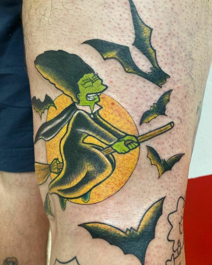 Cartoon tattoo of a witch with bats flying around, inspired by childhood favorites.