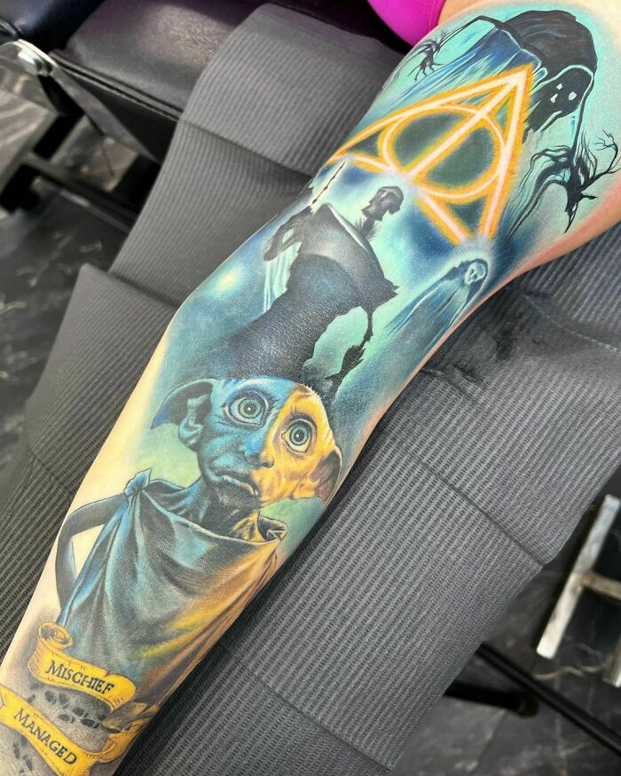 Harry Potter tattoo featuring Dobby, Deathly Hallows symbol, and Dementors, perfect for ultimate fans of the Wizarding World.