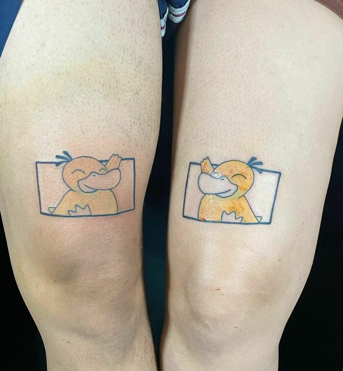 Matching cartoon character BFF tattoos on calves, celebrating friendship with fun designs.