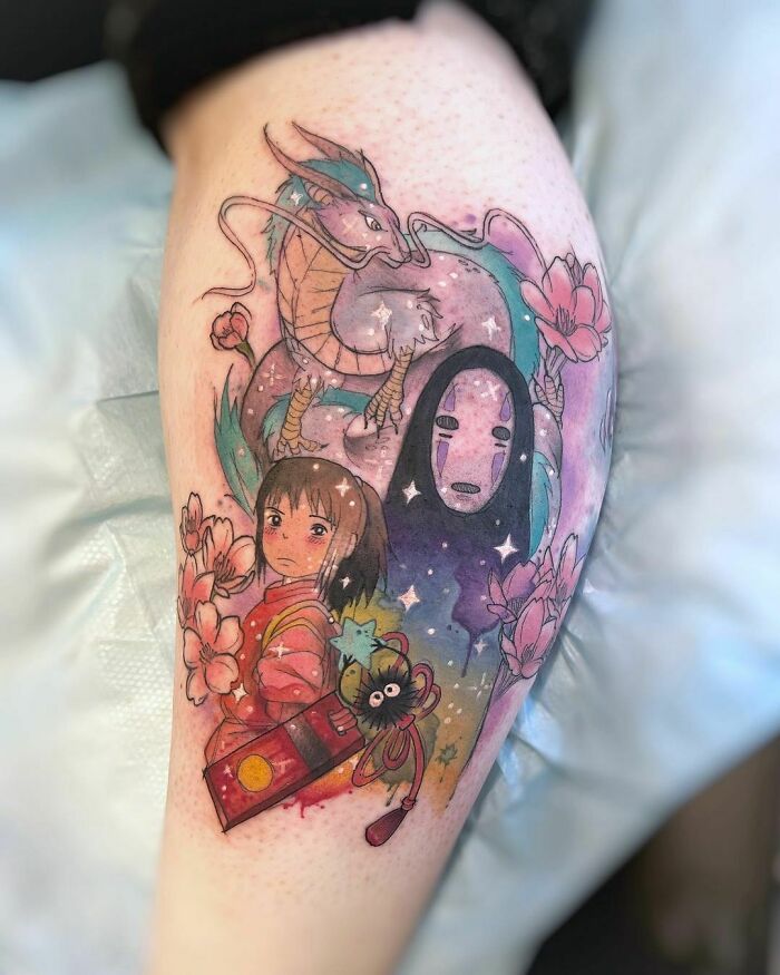 Calf tattoo of cartoon characters from Spirited Away, showcasing vibrant colors and nostalgic elements.