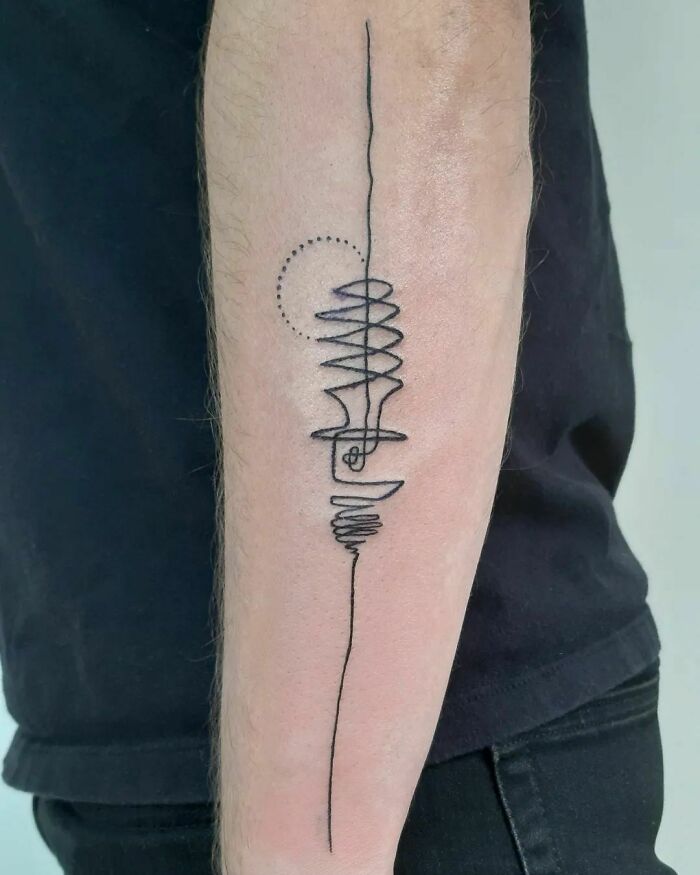 Single-line tattoo on forearm, featuring abstract design with circular and spiral elements.