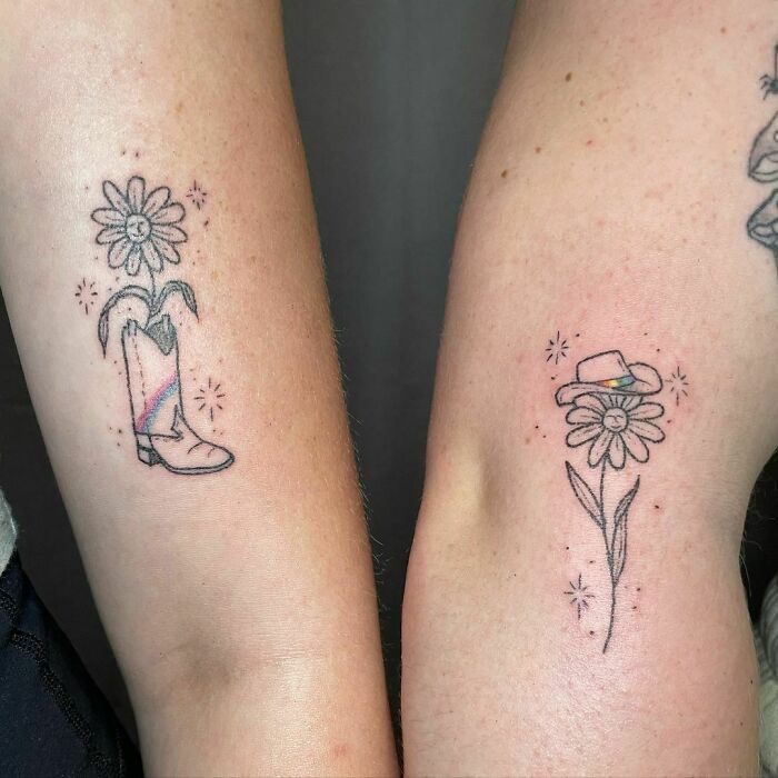 Matching best friend tattoos featuring a boot with a flower and a flower with a hat, symbolizing friendship.