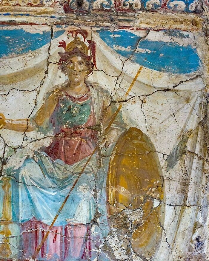 Gallery Of 2 Images.lararium With Wall Painting; Goddess Minerva Sitting On Throne, And Agathodaemon / Genius Loci Snake At Altar With Offerings (Food).pompeii, Parco Archeologico, Antiquarium 63688. By Archaioptix / Cc By-Sa 4.0 Via Wikimedia Commons