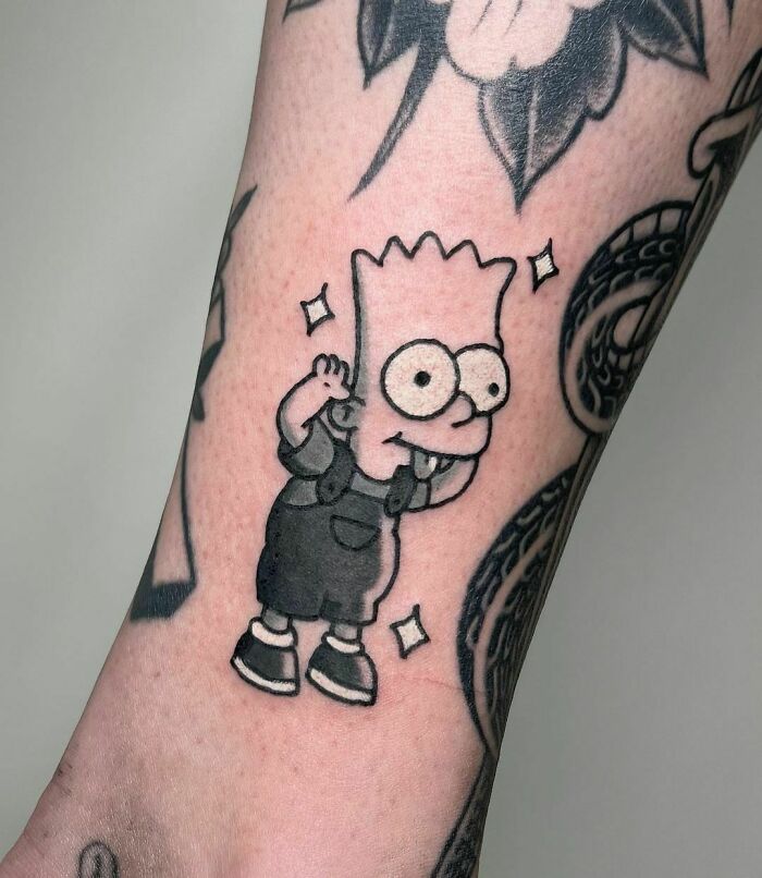 Cartoon tattoo featuring a popular animated character from a beloved TV show on a person's arm.