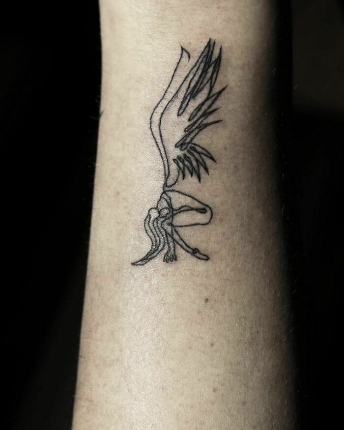 Fine-line single-line tattoo of an angel on an arm.