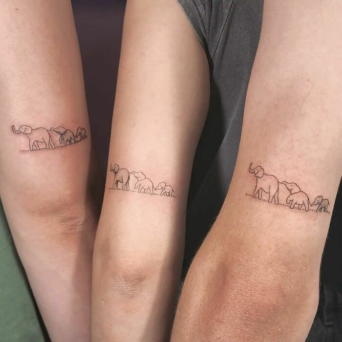 Minimalistic elephant tattoos symbolizing brother and sister bond on forearms.