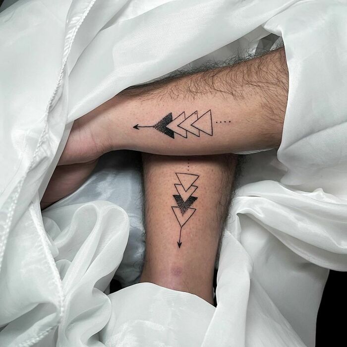 Arrow tattoos on forearms for brother and sister, a simple sibling tattoo idea.