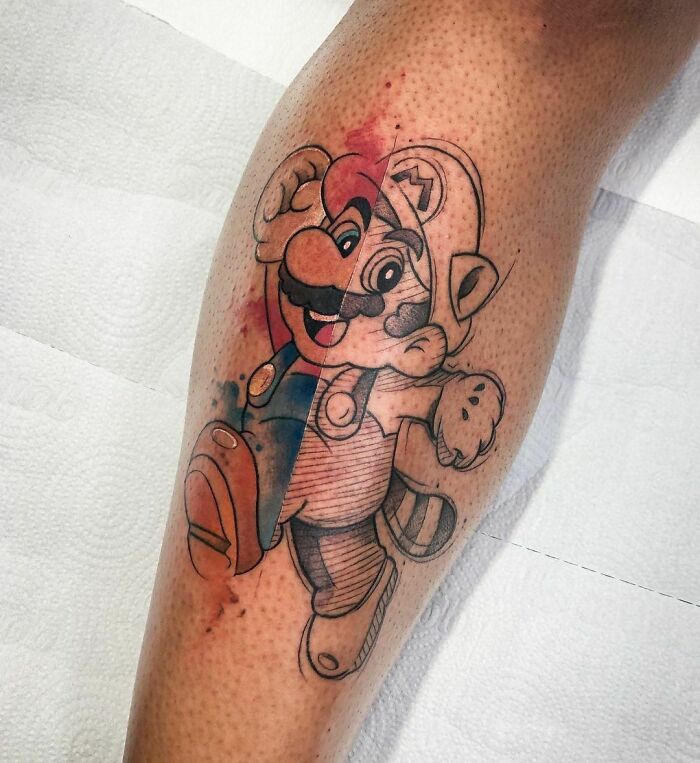 Cartoon tattoo featuring a popular video game character on a person's calf, blending color and outline styles.