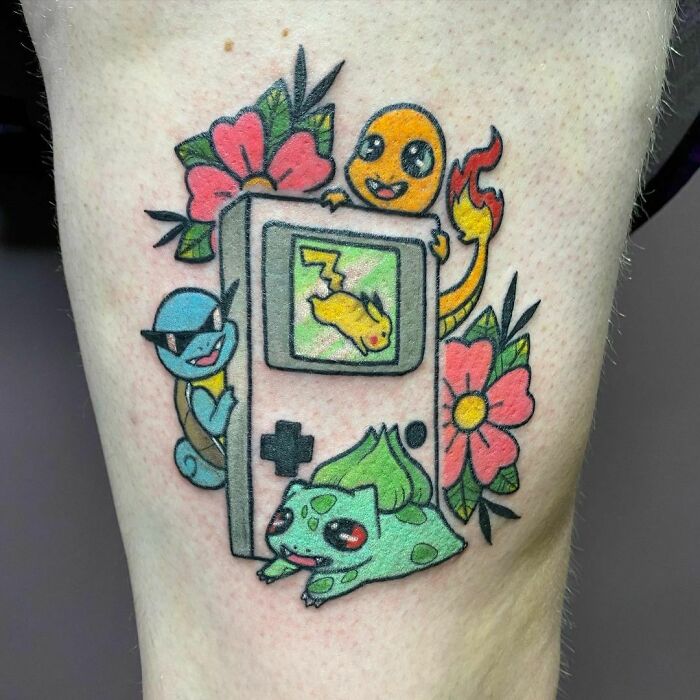 Cartoon tattoos featuring nostalgic characters with a vintage handheld game, surrounded by flowers.