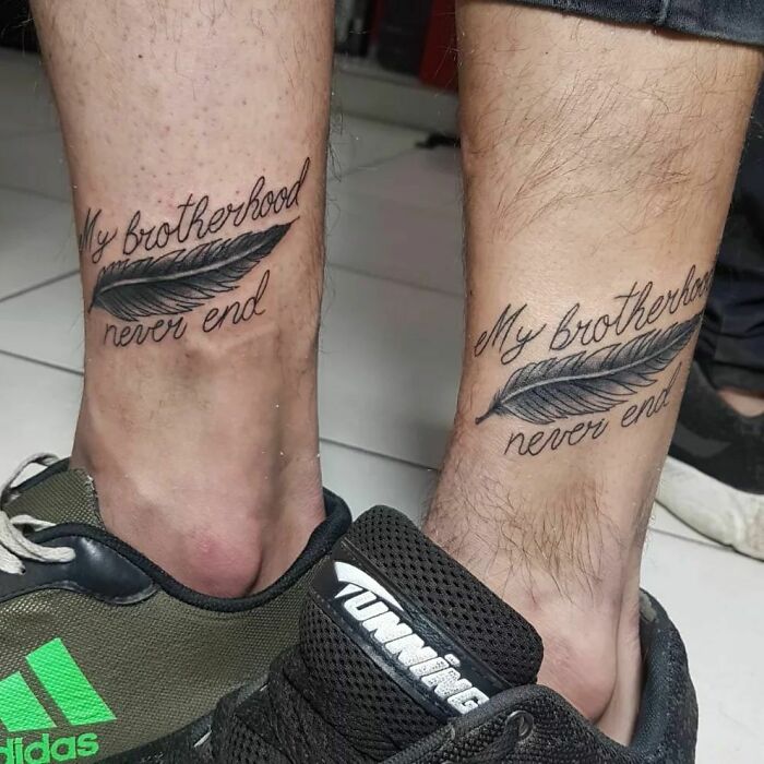 Brother and sister tattoos showing "My brotherhood never end" with feather design on two ankles.