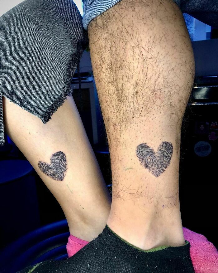 Matching heart tattoos on siblings' legs, symbolizing brother and sister bond.