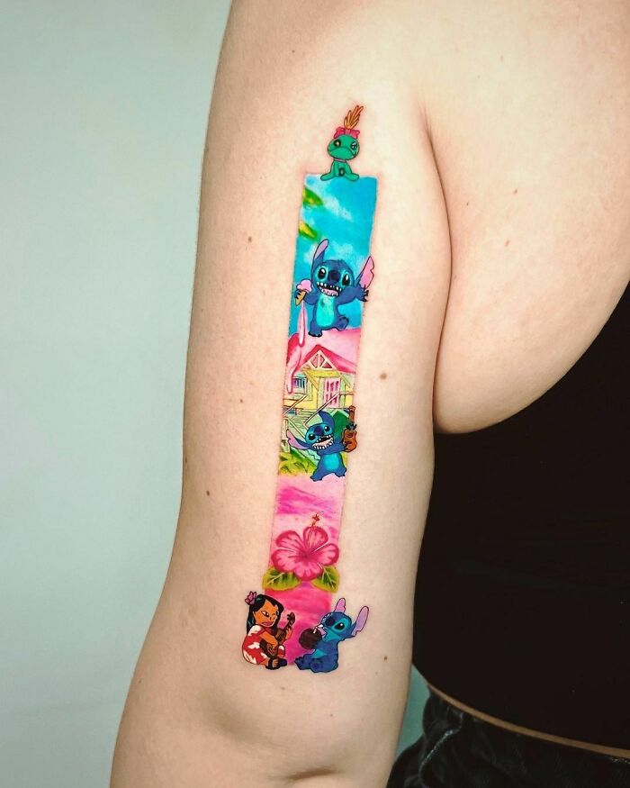 Cartoon tattoo of beloved childhood characters on an arm, featuring vibrant colors and playful designs.