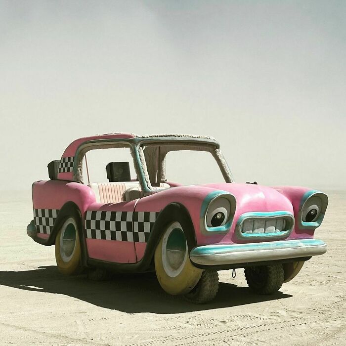 Pink car with eyes as the headlights