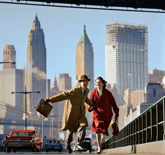 Norman Parkinson Photograph Of Two People Running Up A Street In New York City In 1960