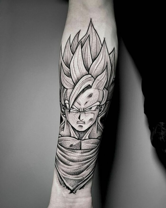 Tattoo of a character from a classic animated show, showcasing bold linework and shading on a forearm.