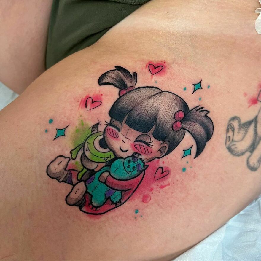 Cute watercolor tattoo of a girl hugging two monsters, surrounded by hearts and stars, showcasing vibrant and playful design.