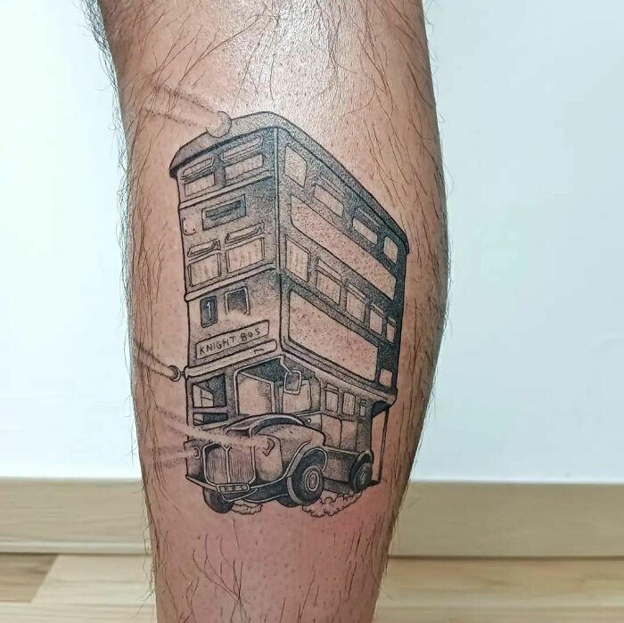 Tattoo of the Knight Bus from Harry Potter on a leg, featuring detailed linework for fans of the Wizarding World.