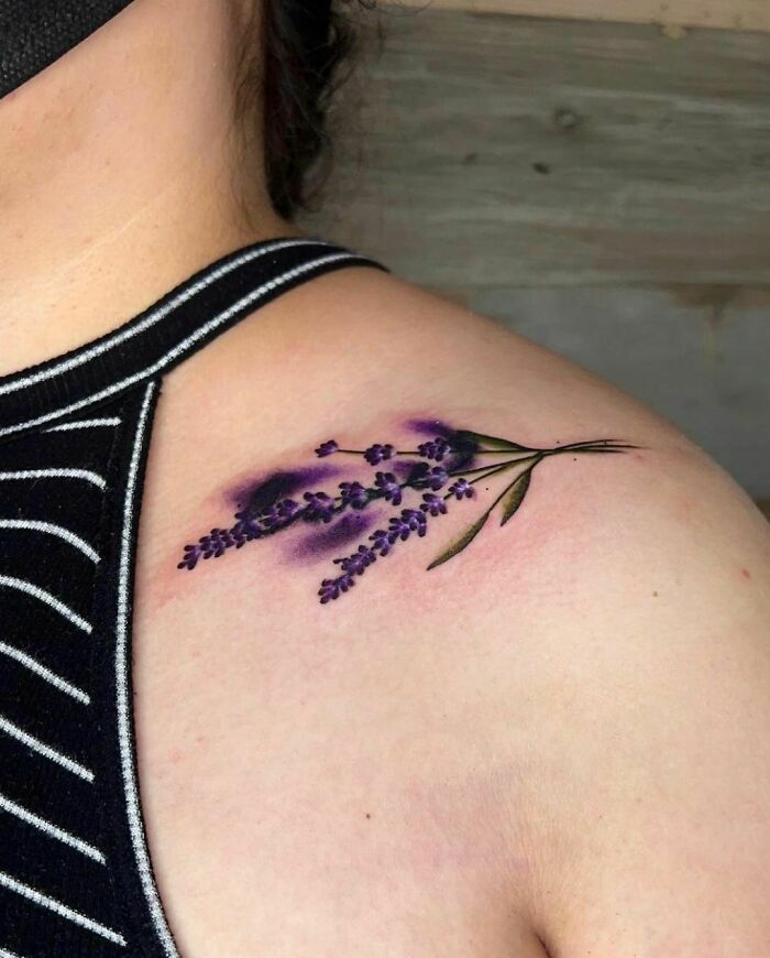 Watercolor tattoo of purple lavender on shoulder, showcasing beautiful inkspiration.