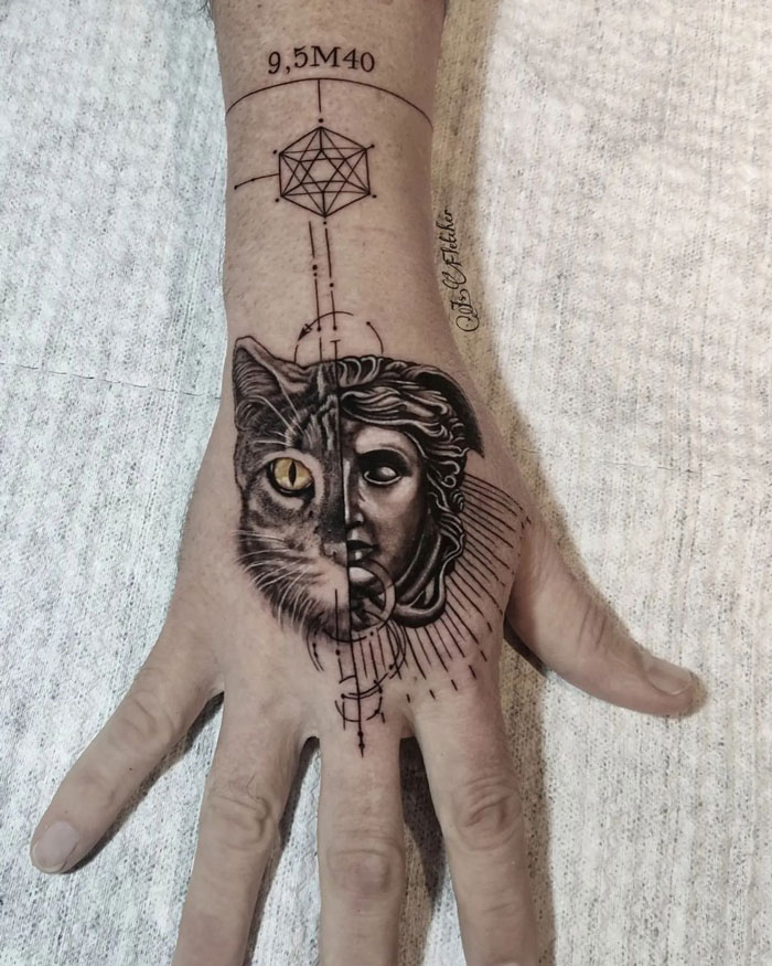 Half cat, half statue tattoo on a hand, featuring intricate geometric designs; unique animal tattoo inspiration.