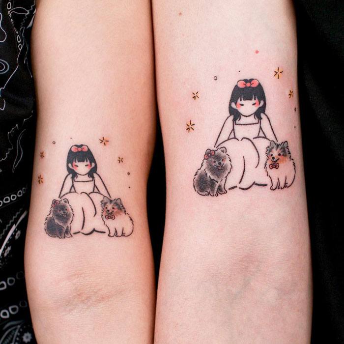 Tattoo of a girl and two small fluffy dogs, showcasing creative animal tattoo design ideas.