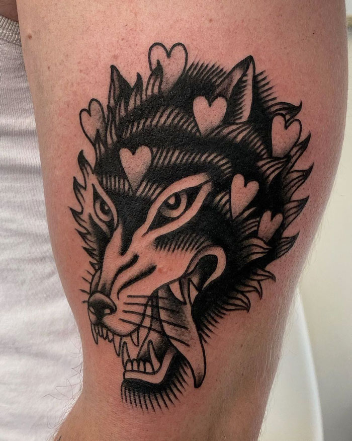 Wolf tattoo design with hearts, showcasing creative animal tattoo ideas.