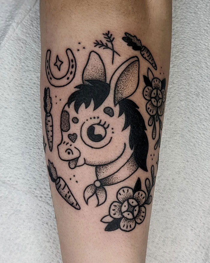 Cute animal tattoo of a horse with flowers and carrots, celebrating the animal kingdom.