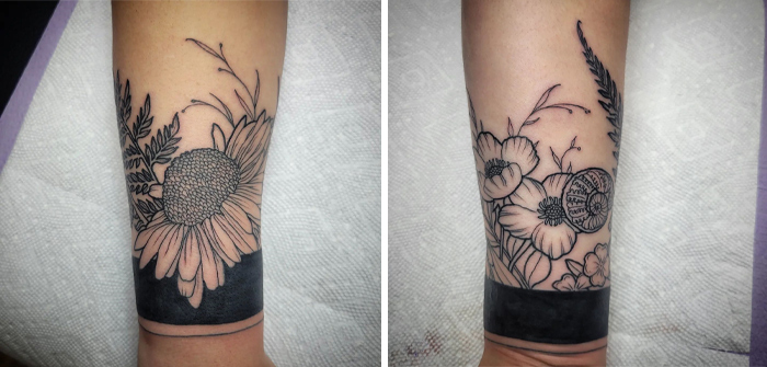 Floral armband tattoo design with a black band on the forearm, showcasing detailed flowers and leaves.