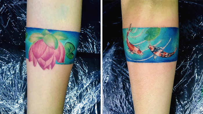 Colorful armband tattoos featuring a lotus flower and koi fish, showcasing artistic tattoo designs.