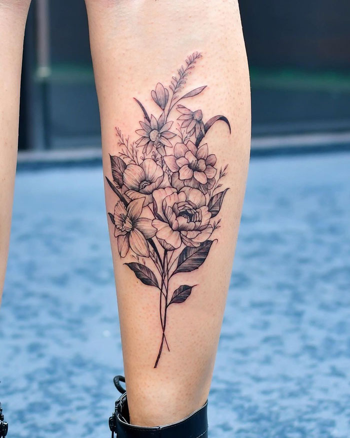 Floral calf tattoo design showcasing intricate, unique details and artistry.