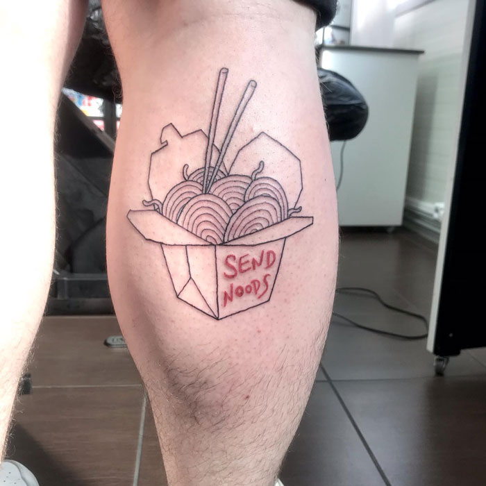 Calf tattoo featuring a takeout box with noodles and chopsticks, captioned "Send Noods".
