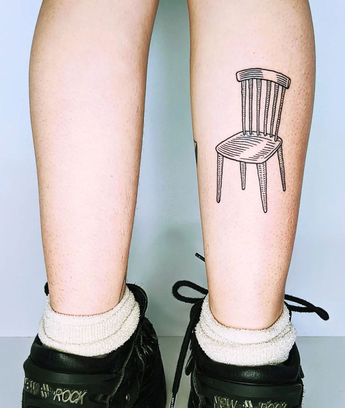 Calf tattoo of a simple chair design, showcasing coolness and creativity.