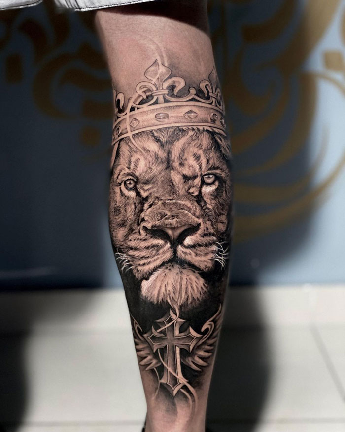 Lion with crown calf tattoo design, showcasing pure coolness and intricate detail.