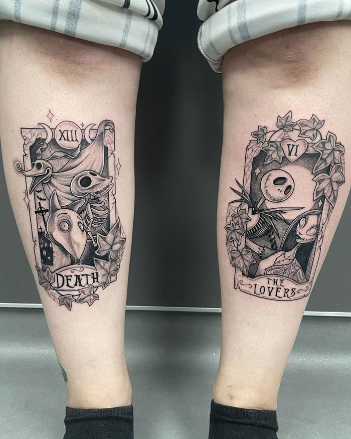 Dual calf tattoos featuring intricate designs from tarot cards, showcasing creativity and coolness.