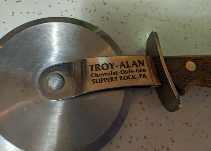 This Pizza Cutter That Was Given To My GF When She Bought A Car Years Ago. Seems Like An Odd Gift To Give When Selling A Car & Odder Way To Advertise Their Dealership