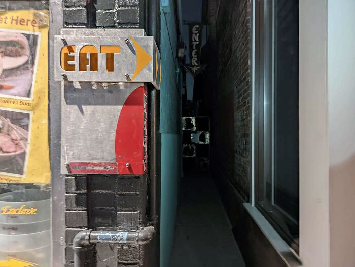 We Found An Entrance That Just Says "Eat" With A Sign To An Ally