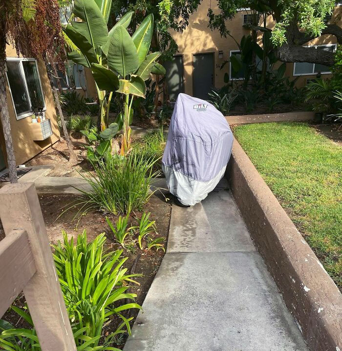 Neighbor Parked Motorcycle On Walkway Blocking Path To Multiple Apartments