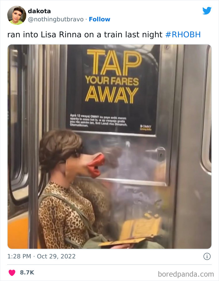 Person wearing a creative Halloween costume with exaggerated lips on a subway, nailing Halloween this year.