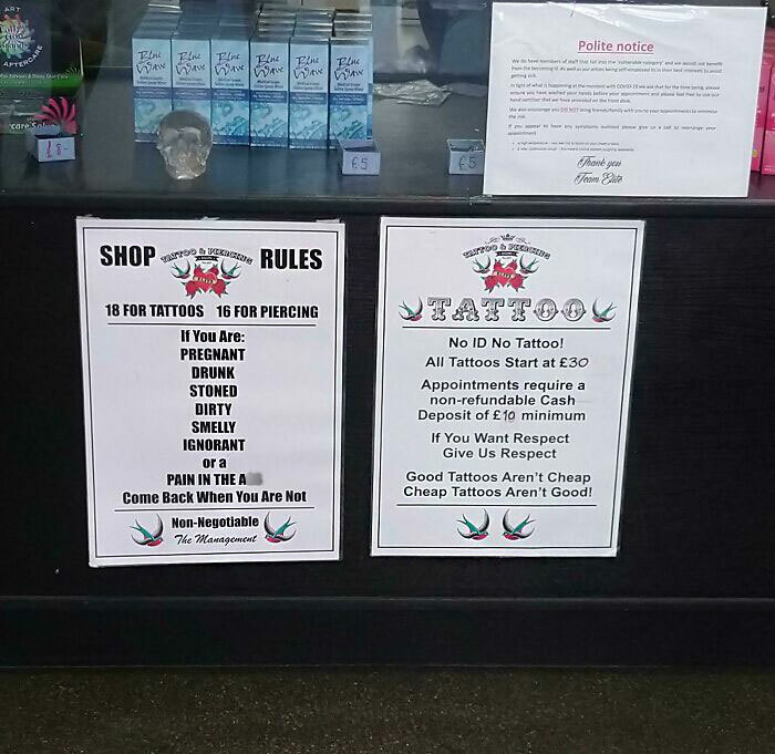 Tattoo shop rules sign detailing conditions for getting tattoos, emphasizing customer behavior and age requirements.