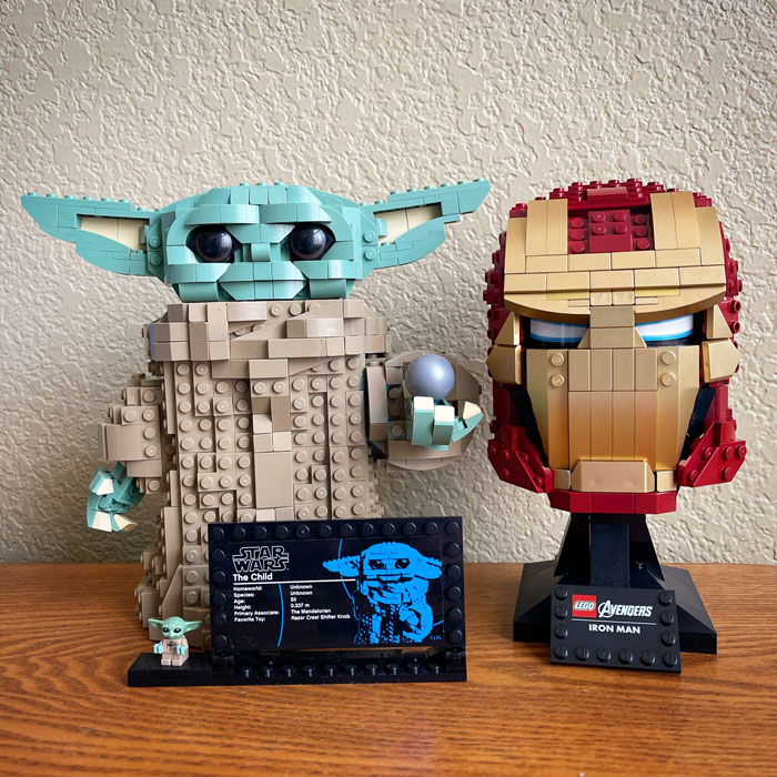 LEGO builds of Star Wars The Child and Avengers Iron Man helmets, showcasing incredible detailed brick design art.