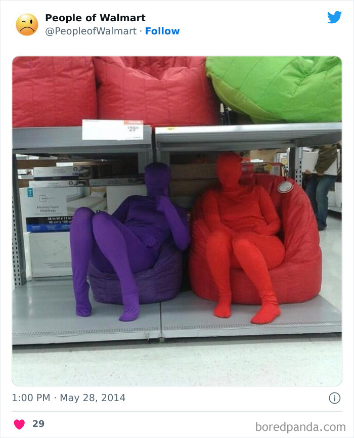 People in colorful bodysuits sitting on beanbags in Walmart aisle.