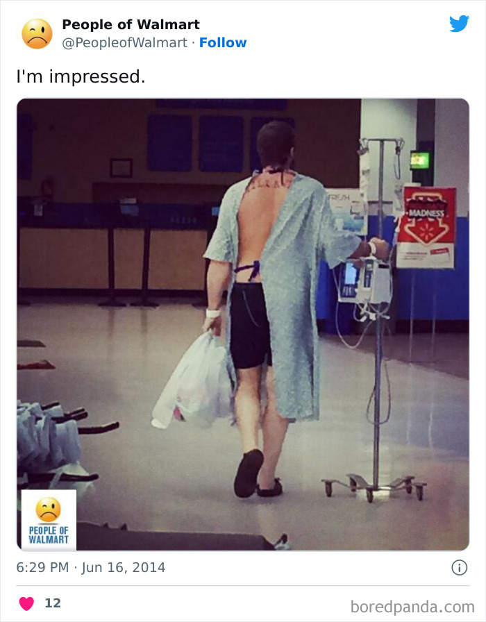 Person in hospital gown, carrying shopping bags in Walmart, presenting a shocking sight.