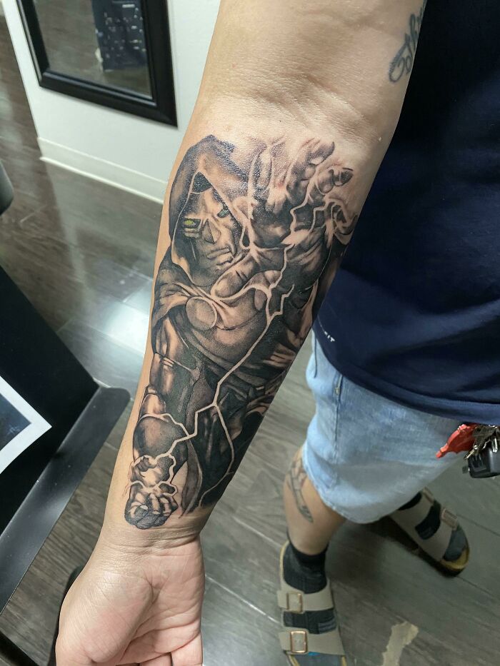 Marvel tattoo of a detailed character on a person's forearm.