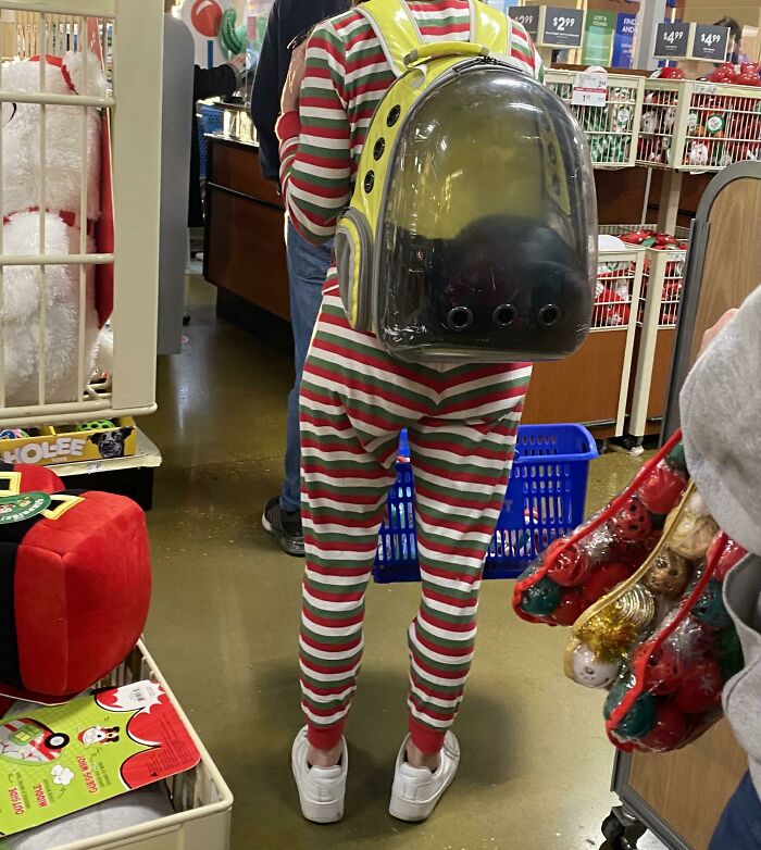 Saw A Girl Wearing A Cat In A Backpack While In Line At The Pet Store
