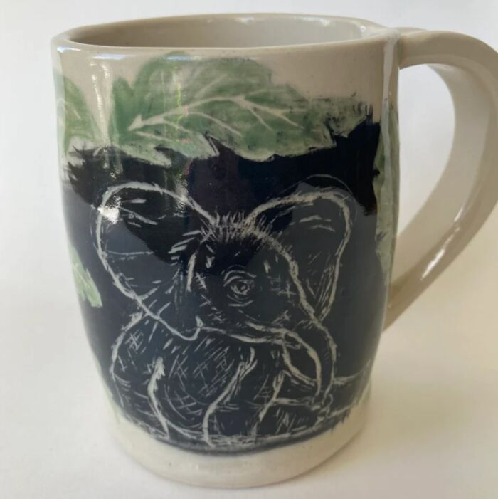 A Baby Elephant Finds Its Feet In A Clearing