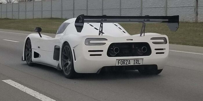 Ultima RS Randomly On The Freeway. Very Appropriate License Plate!