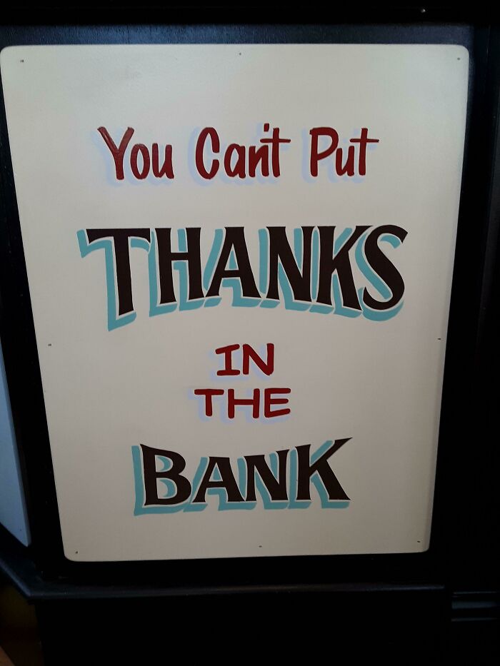 Sign with text: "You Can't Put Thanks in the Bank," reflecting customer challenges for tattoo artists.