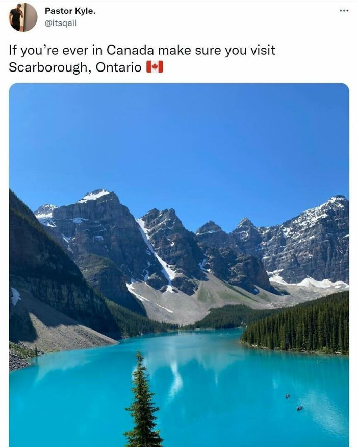 Canadian meme showing a beautiful turquoise lake surrounded by mountains under a clear blue sky.