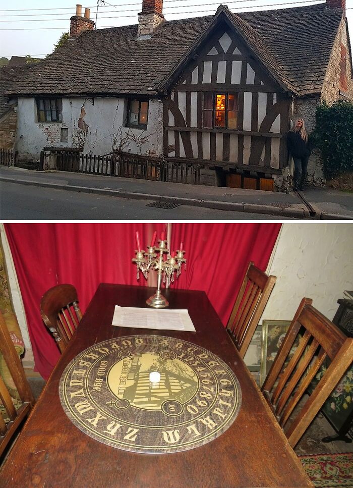 Old white color Ancient Ram Inn and inside brown table with chairs